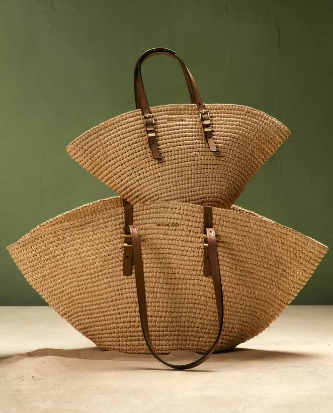 <strong>THE MICHAEL KORS COLLECTION</strong>Shaped for the sun designs with a blend of glamour and effortless style.